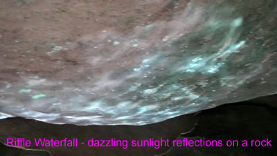 video clip of the dazzling sunlight reflections on a rock at the Riffle Waterfall in Millwood WV